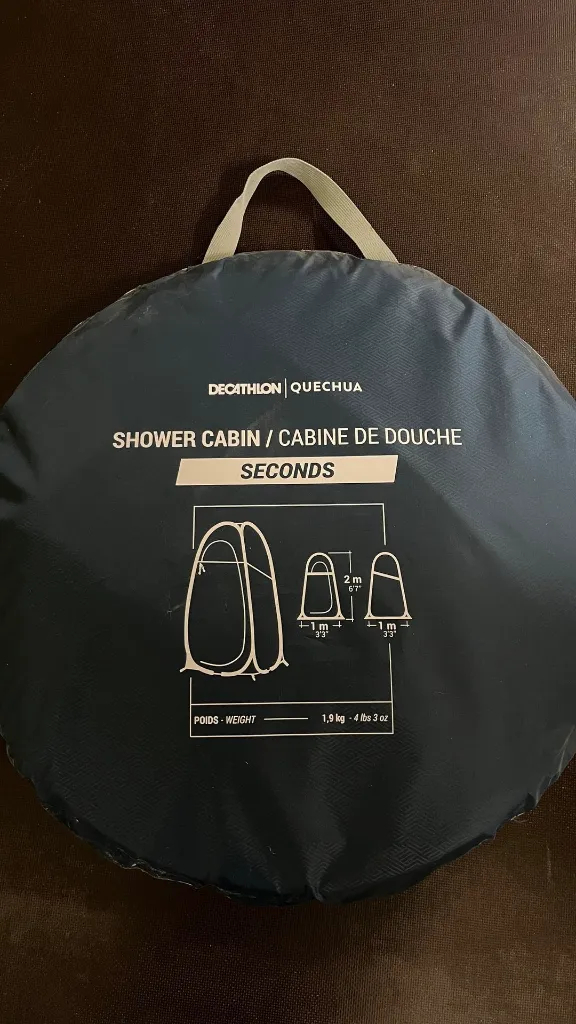Cabine de douche pliée.webp